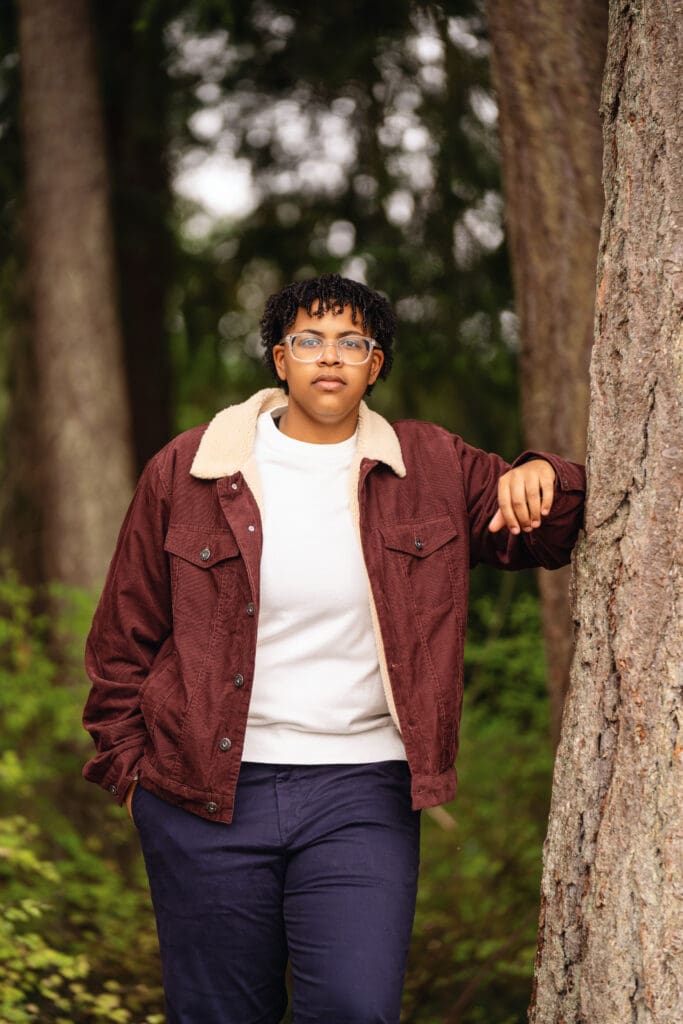 Relaxed outdoor photo of a senior at Pine Lake Park, captured by Issaquah senior photographer.