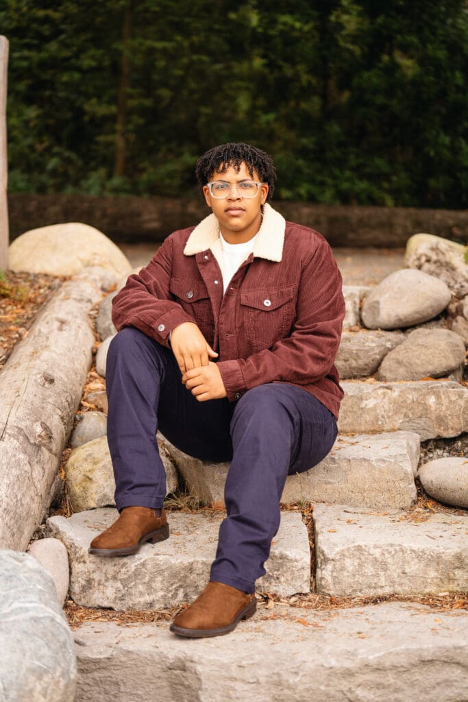 Senior portrait at Pine Lake Park in Sammamish, surrounded by natural greenery.